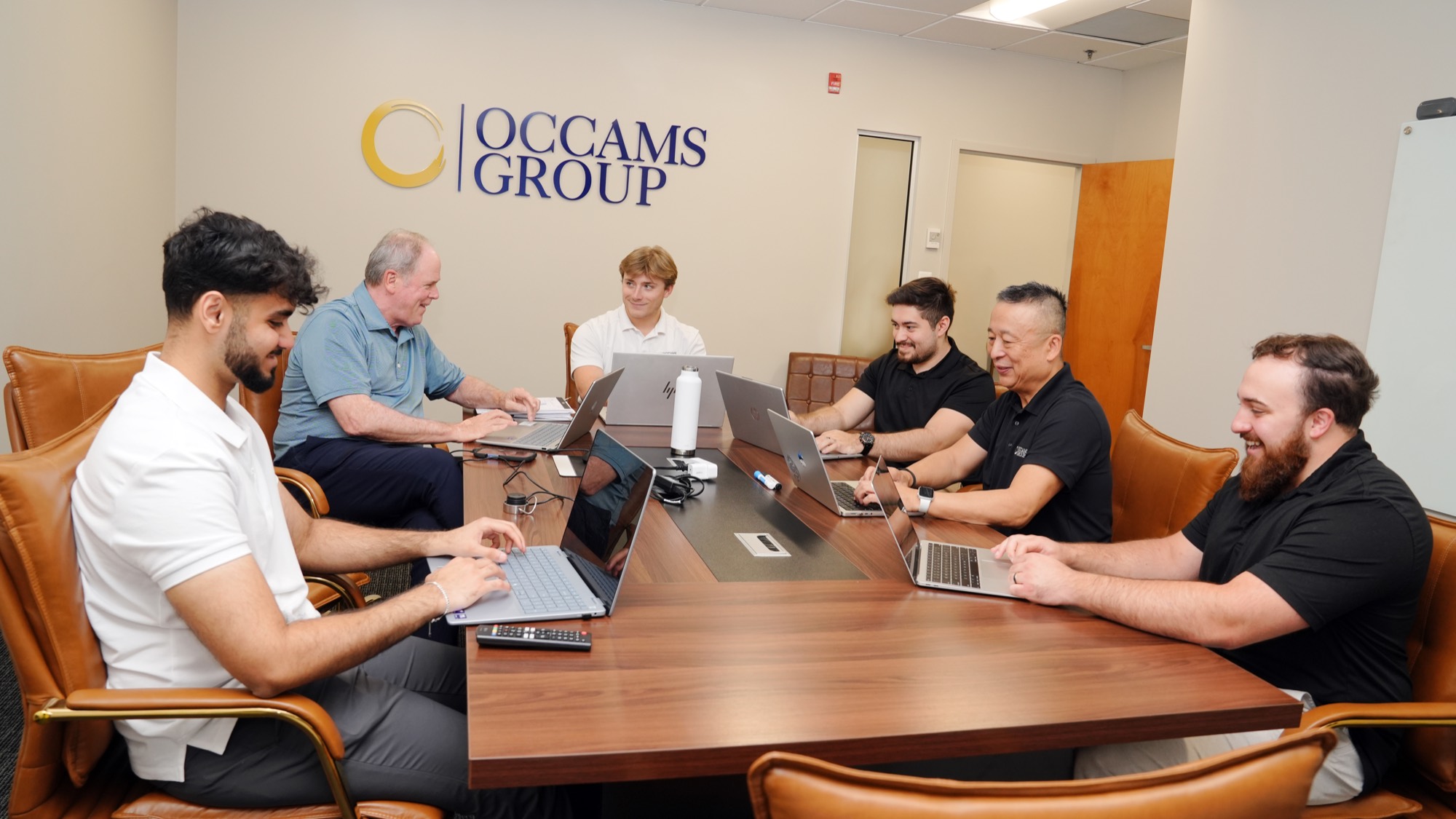 The Occams Group team at the Columbia office. From left: Aliyaan, Tim, Tyler, Nelson, Kenny, and Phil.